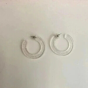 Clear sparkly chunky hoop earrings.